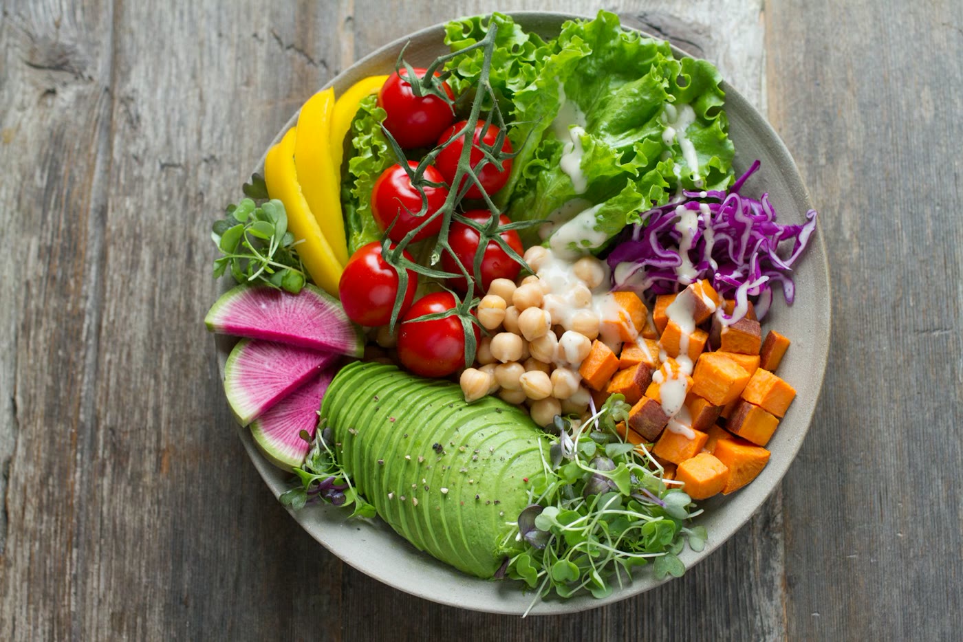 Colorful plant-based bowl with avocado and roasted vegetables